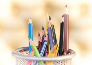 shallow focus photography of pencils on desk rack